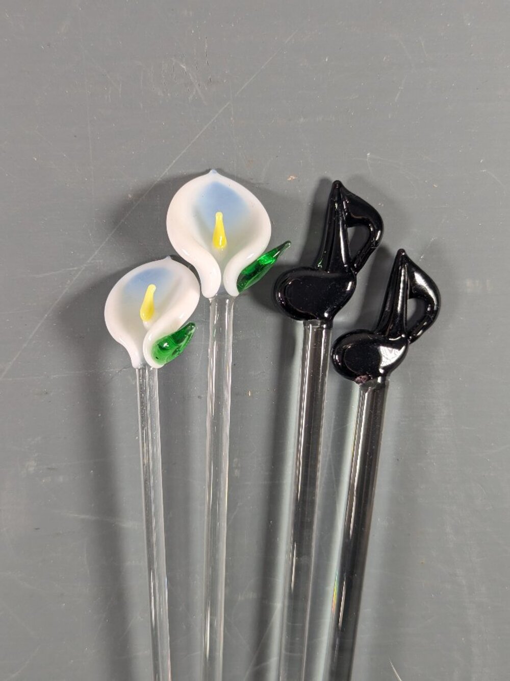 Set of 4 glass swizzle sticks, calla lilies and music notes